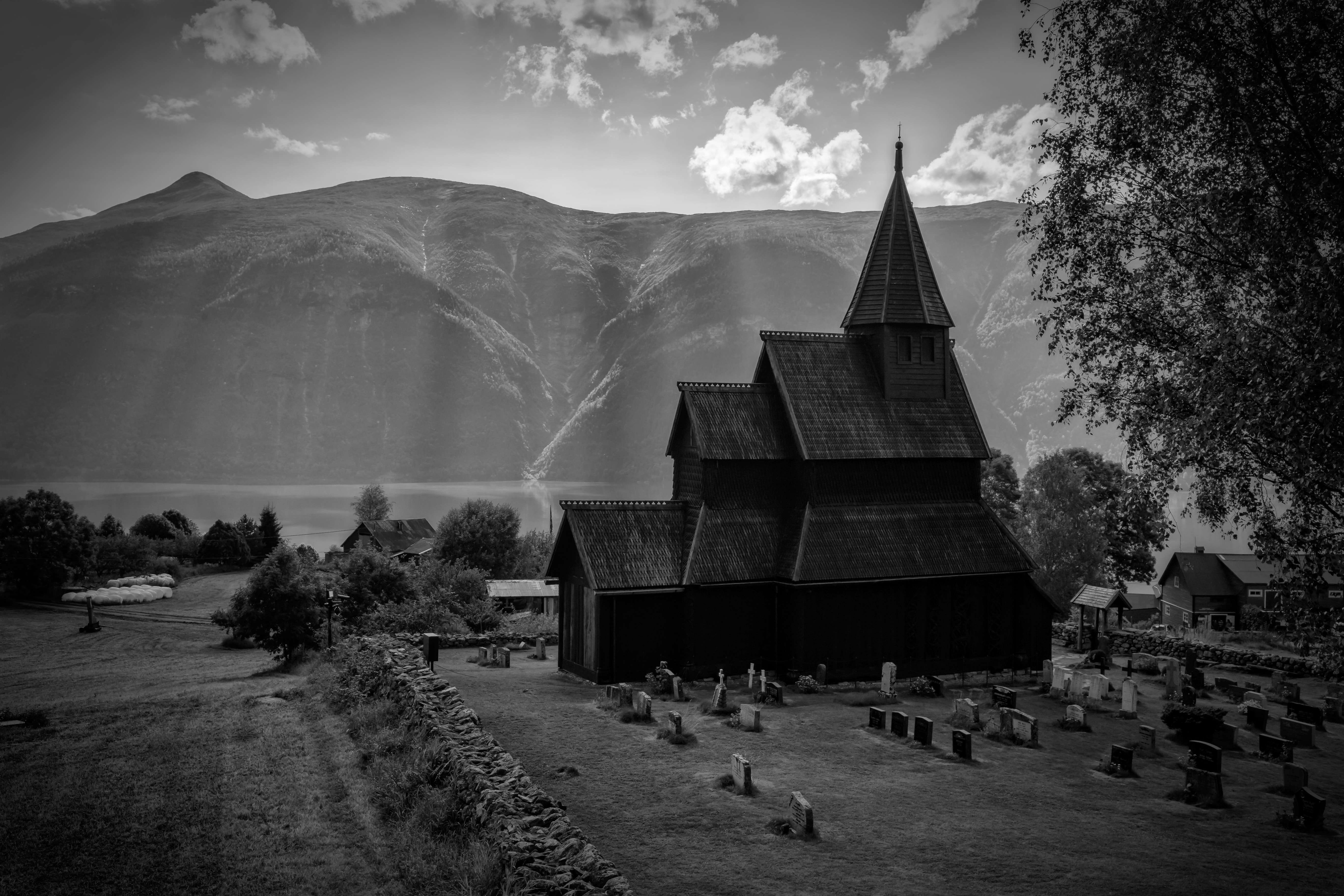 Dark-grep image of church and cemetery.