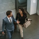 Woman and man walking and talking in airport